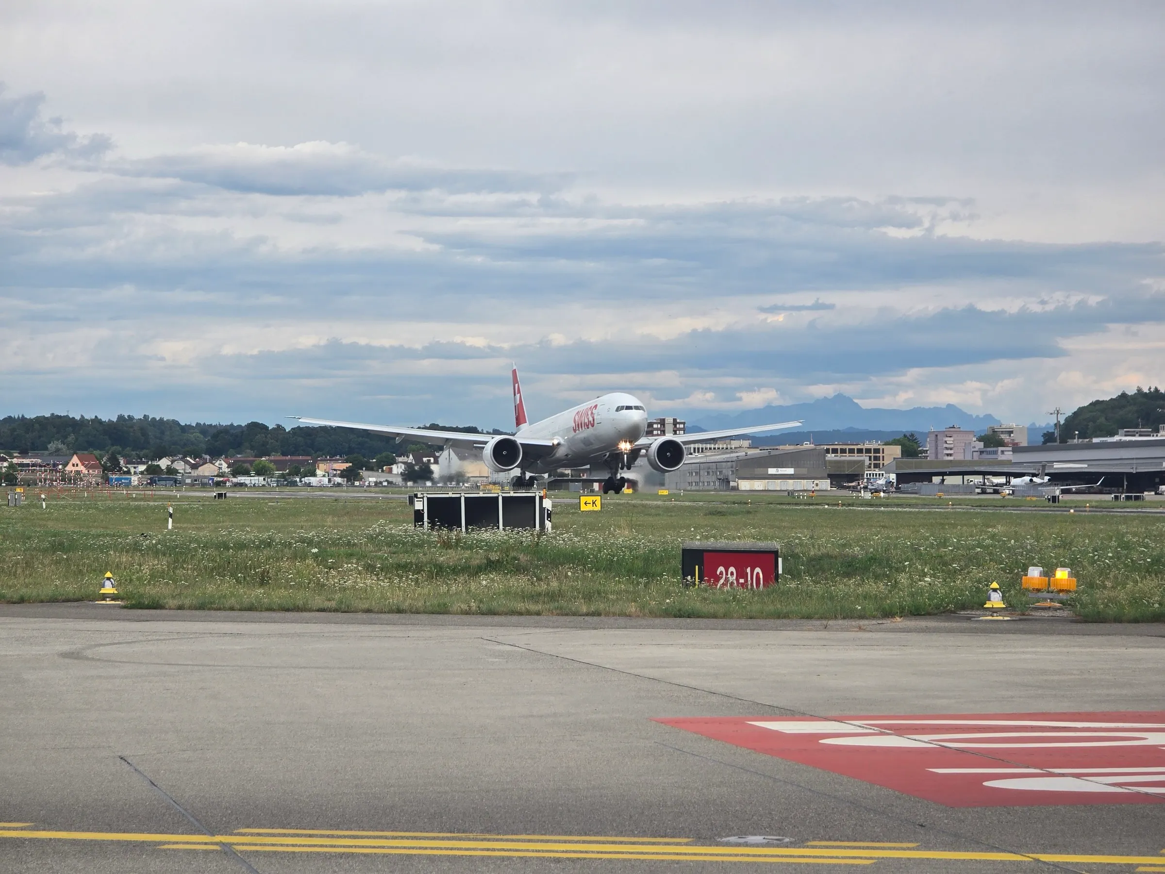 A SWISS Boeing 777 departing Zürich as seen from the ground