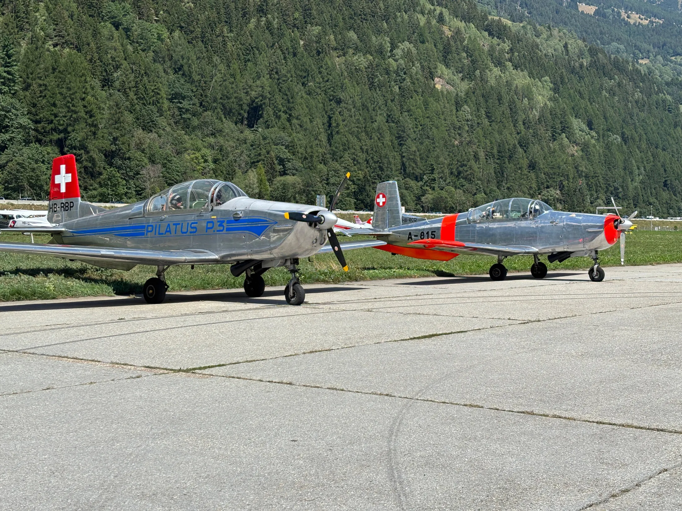 Two Swiss Pilatus P-3 trainers on the apron