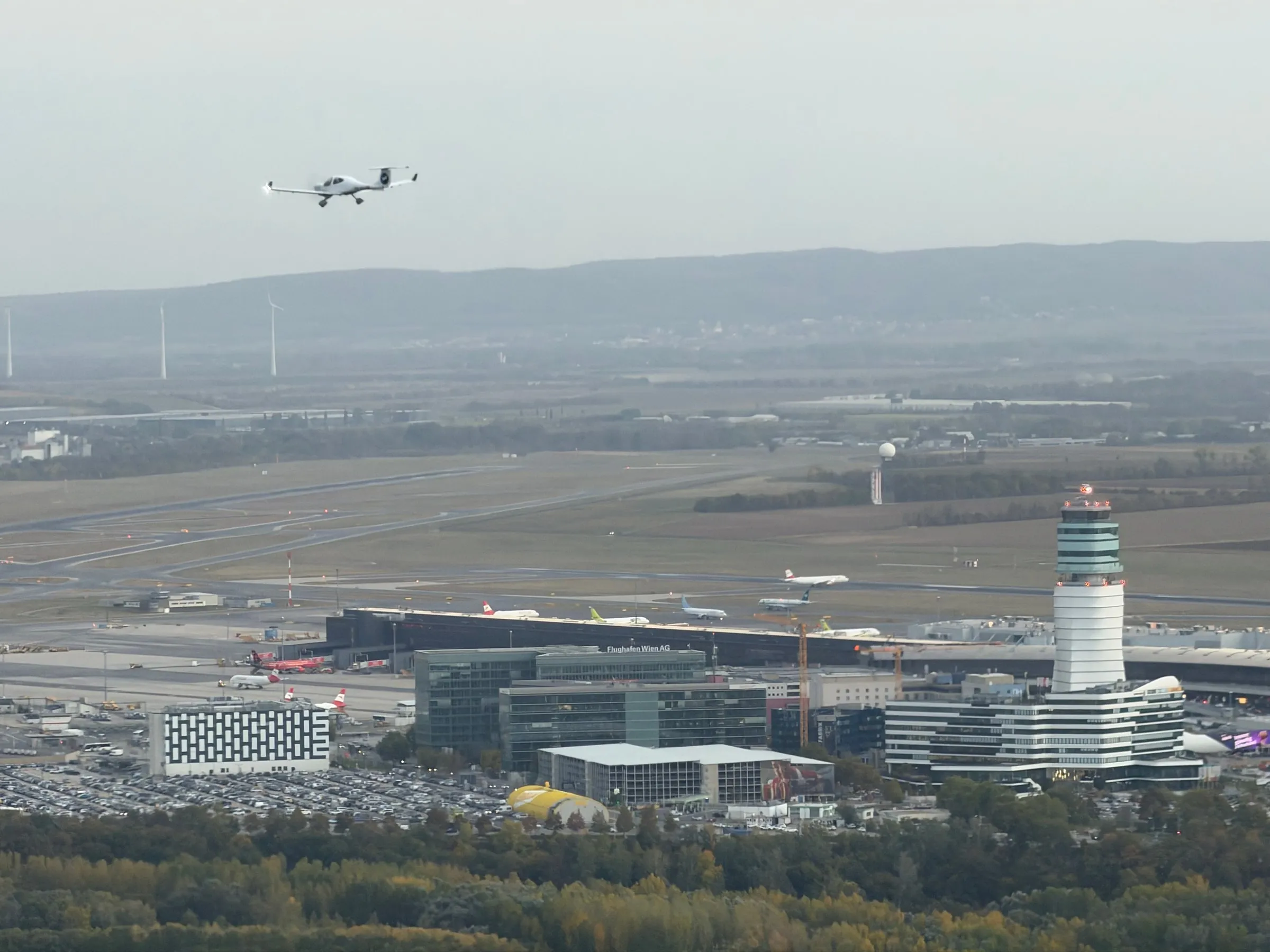 The other Diamond flying above Vienna Airport with the control tower below